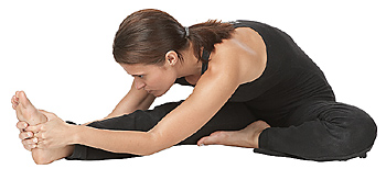 woman doing forward bend yoga pose